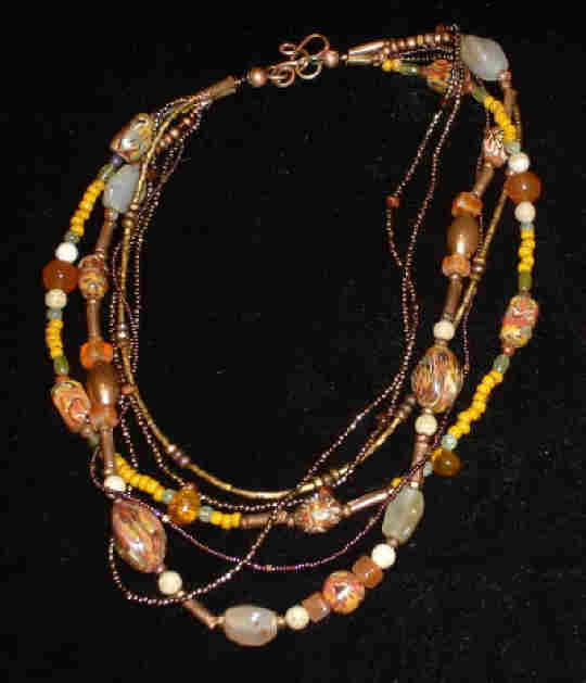 Bonnie Mincu's yellow ethnic multi-strand necklace for Dale